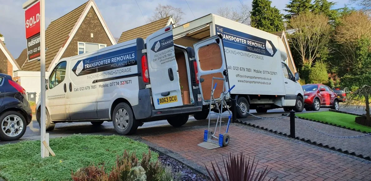 House Removals An image of two removal vans outside a house.