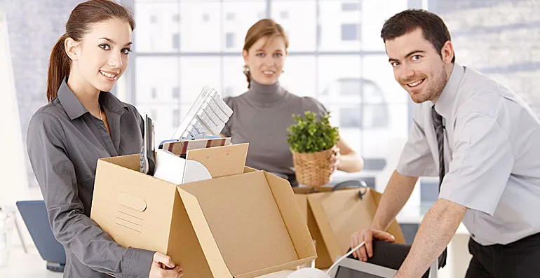 removalspro-image image of an office team with packed boxes for the removal team